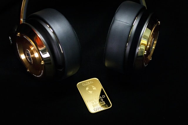 gold and golden headphones
