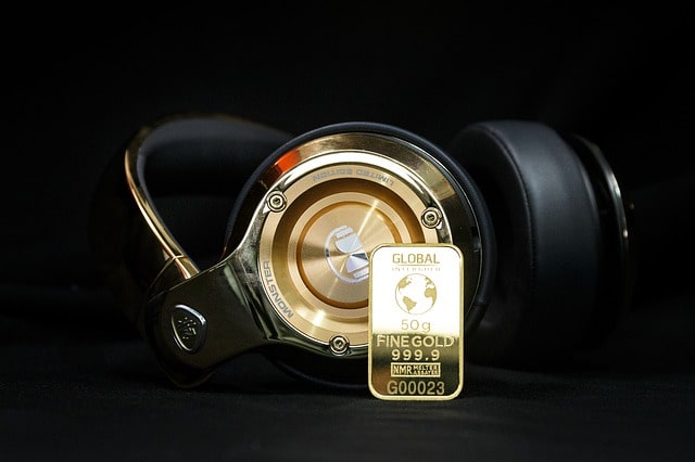gold and golden headphones